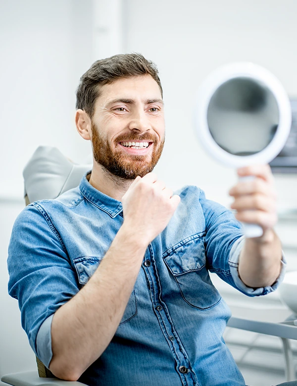 Man Smiling Looking at the Mirror