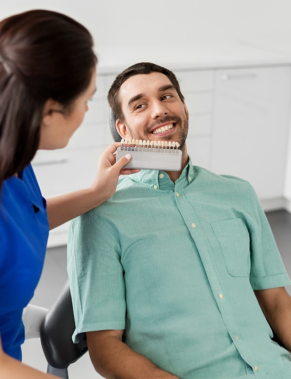 Dentist Checking The Matching Teeth