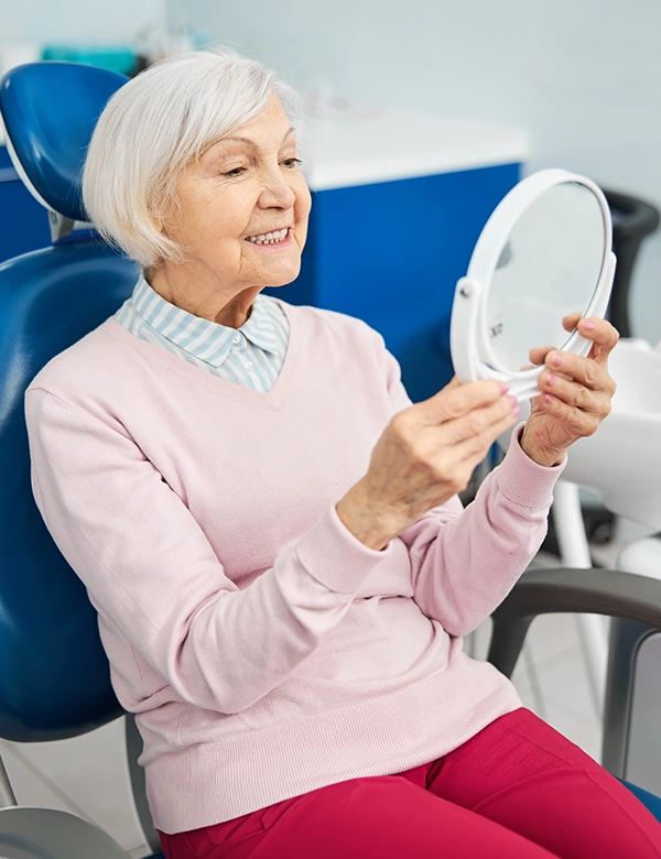 Woman Smiling Staring at Mirror
