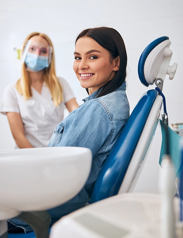 Woman smiling Lying On Dentist Chair