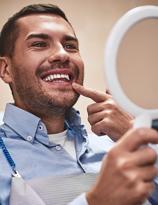 Man Smiling Looking at the Mirror