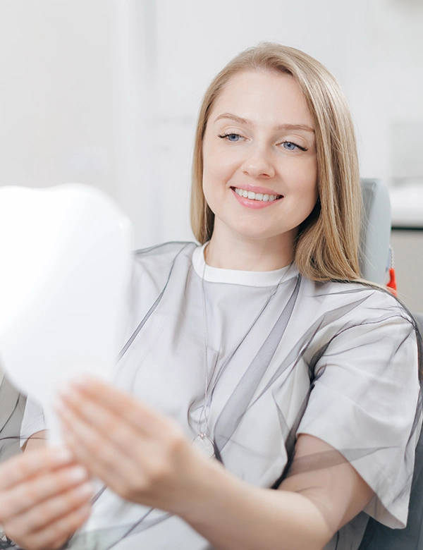 Woman Smiling Staring at Mirror