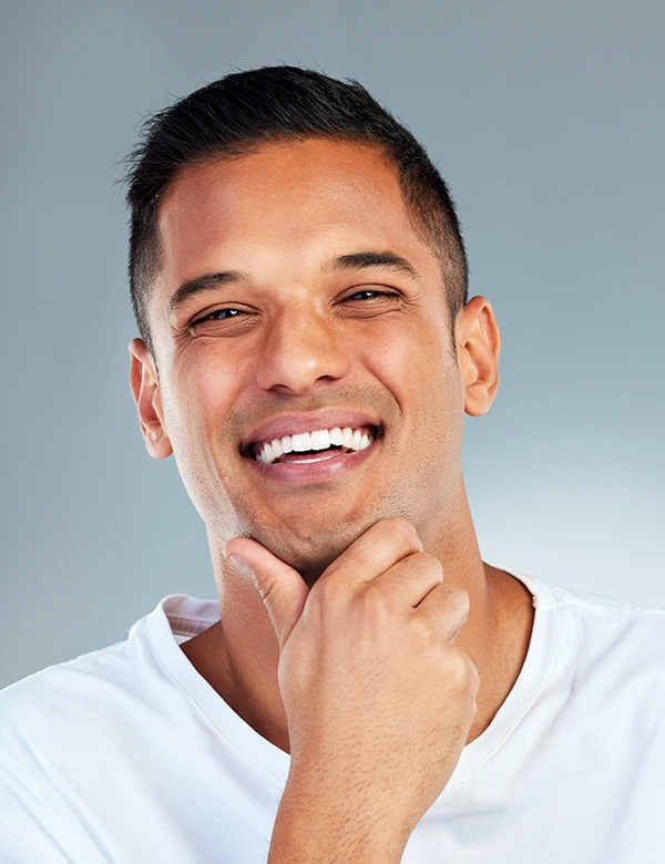Man Smiling with Hand on Chin