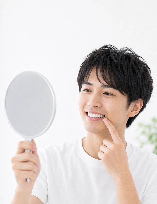 Man Smiling Looking at the Mirror